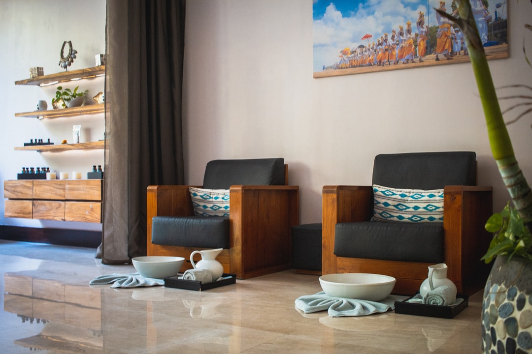 A wall-mounted wooden cabinet below the shelves, maintaining the natural wood theme.